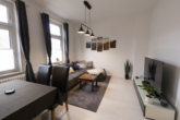 Wohnzimmer - Renovierte Oberwohnung mit Balkon in alter Stadtvilla von Emden