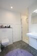 Charmante 2-Zimmerwohnung in einer Neubau-Villa mit Tiefgarage in zentraler Lage von Aurich - Badezimmer