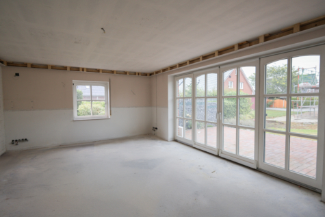 Erdgeschosswohnung mit eigenem Garten und großer Terrasse in beliebter Wohnlage von Warsingsfehn - Wohnküche (39882)