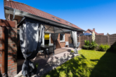 WE EG rechts: Terrasse mit Gartenanteil - Attraktive Kapitalanlage: Gepflegtes 4-Parteienhaus in ansprechender Lage von Moormerland-Oldersum