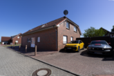Nord-West-Ansicht - Attraktive Kapitalanlage: Gepflegtes 4-Parteienhaus in ansprechender Lage von Moormerland-Oldersum