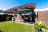 WE EG links: Terrasse mit Gartenanteil - Attraktive Kapitalanlage: Gepflegtes 4-Parteienhaus in ansprechender Lage von Moormerland-Oldersum