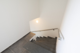 Treppenhaus - Neubau Dachgeschosswohnung in bester Ortskernlage von Remels